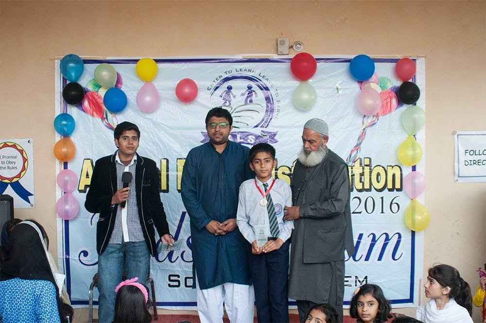 Kids Lyceum student receiving an award